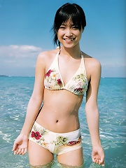 Milky skinned asian beauty showing off her hot body in a bikini