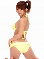 Cute little asian chick is adorable in her bright yellow bikini